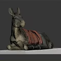 Detailed Donkey Sculpture Lying On White Base With Red Blanket