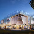 Modern Commercial Complex With Glass Facade Glass Roof Outdoor Lawn Trees And Evening Lighting