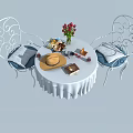 Wrought Iron Table and Chair Set with Round White Tablecloth Red Roses and Blue Cushions