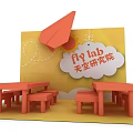 Orange Paper Airplane Themed Fly Lab Space With Tables Benches And Yellow Background