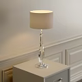 Modern Crystal Base Table Lamp With Cream Lampshade On Bedside Table