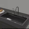 Modern Kitchen Sink With Stainless Steel Faucet and Plate of Apples on Black Countertop