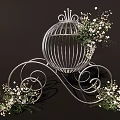 White Decorative Birdcage with Curved Scroll Legs and White Flowers Green Foliage on Dark Background
