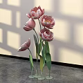 Floral Display With Pink Tulips Green Stems And Metal Bases On Gray Floor