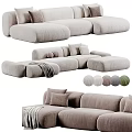Plush Sectional Sofa in Neutral and Green Tones with Soft Cushions and Throw Blanket