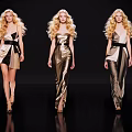 Three Female Models In Gold Black Dresses With Long Blonde Hair Walking On Runway