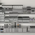 Various Stainless Steel Kitchen Appliances Display With Modern Cabinets And Shelves