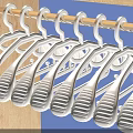 White Plastic Hangers Hanging On Metal Rod For Daily Household Use