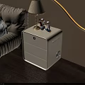 Modern White Bedside Table With Drawer Table Lamp And Figurines In Bedroom With Wooden Floor