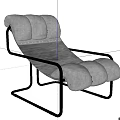 Black Leather Lounge Chair With Padded Cushions And Modern Metal Frame Design