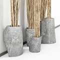 Natural Garden Decor With Dried Branches In Gray Stone Vases Against White Wall