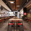 Modern Restaurant Interior Design With Wooden Tables Red Seats Hanging Lights And Wall Decor