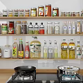 Neatly Arranged Various Spice Bottles On Kitchen Shelves With Stove And Pans