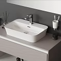 White Rectangular Washbasin With Chrome Faucet On Gray Countertop With Aromatherapy Sticks And Toothbrush Holder