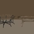Two Stylish Coffee Tables With Glass Tops And Decorative Metal Leg Designs