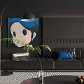 Elegant Modern Living Room Featuring Black Sofa Blue Cushions Round Coffee Table And Wall Art