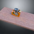 Industrial Mechanical Equipment With Orange Casing Placed On Wooden Platform Surface