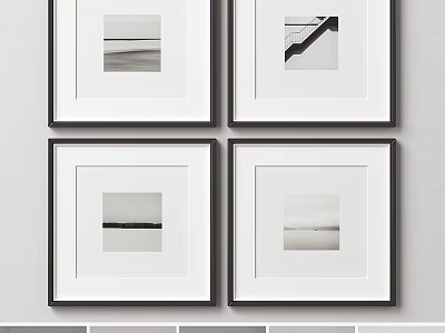 Four Black And White Framed Artworks Hanging On Minimalist Wall Decor 3d model