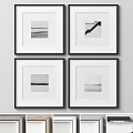 Four Black And White Framed Artworks Hanging On Minimalist Wall Decor