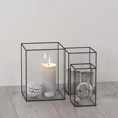 Decorative Ornament Set With Black Metal Frame Glass Containers Lit Candle And White Spherical Ornament 3d model
