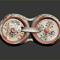 Pair of Decorative Ceramic Containers With Floral Patterns And Orange Rimmed Lids