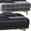 Gray Plaid Fabric And Black Leather Ottoman With Wooden Legs And Draped Black Blanket
