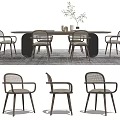 Modern Wooden Dining Table Set With Rattan Back Chairs And Potted Plant On Rug