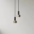 Two Modern Pendant Lights With Beige Shades And Black Metal Frames For Interior Decor