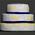 Three Tier White Cake with Blue Ribbons Yellow Heart Patterns and Drizzle Design
