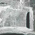 Ancient Stone Archway with Wooden Door Greenery and Stone Pavement in Historic Setting