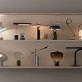 Various Modern Table Lamps With Stylish Designs Showcased On Shelves For Home Decor