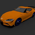 Orange Toyota Sports Car Featuring Black Rear Spoiler And Blue Alloy Wheels