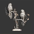 Perched Owls on Branch with Yellow Leaves and Wooden Base in Dark Background
