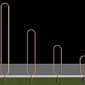 Commercial Equipment Metal Ring Structures With Various Heights And Black Bases On Green Grass