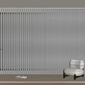 White Vertical Blinds in Modern Interior with Wooden Floor and Armchair