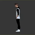 Young Man Standing In Casual Attire With Gray Vest Black Pants And White Shoes