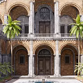 Historic Arched Courtyard Garden With Central Fountain Palm Trees And Reflecting Pool
