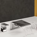Modern Bathroom Faucet With Water Flow Design And Marble Decor On White Countertop