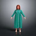 Woman In Green Long Dress With White Trim Standing Barefoot Against Gray Background