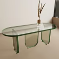 Oval Shaped Glass Top Dining Table With Green Legs And Pampas Grass Vase