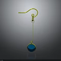 Gold Earrings with Round Blue Gemstone Pendant and Gold Hook Reflection on Dark Background