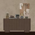 Wooden Console Table With Decorative Items And Artwork On Textured Wall