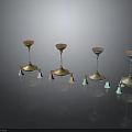 Elegant Decorative Candle Holders With Four Stylish Metal Bases And Colored Tassel Accents