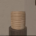 Bamboo Tea Steamer With Striped Design Placed On Wooden Table Against Beige Wall