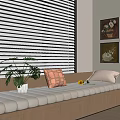 Cozy Bay Window Interior With Cushioned Seat Throw Pillows Green Plant And Wall Art