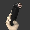 Black Handheld Device With Circular Front And Pink Section Held In Hand 3d model