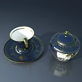 Elegant Dark Blue Teacup with Gold Patterns on Saucer and Matching Lidded Container