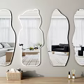 Irregular Shaped Wall Mirrors Reflecting Living Room Furniture And Curtains