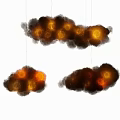 Fluffy Cloud Shaped Chandeliers With Lit Interior Hanging As Decorative Lighting Fixtures