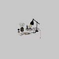 Decorative Accessories Set Featuring Gold Lamp Globe White Flowers Books And Stationery